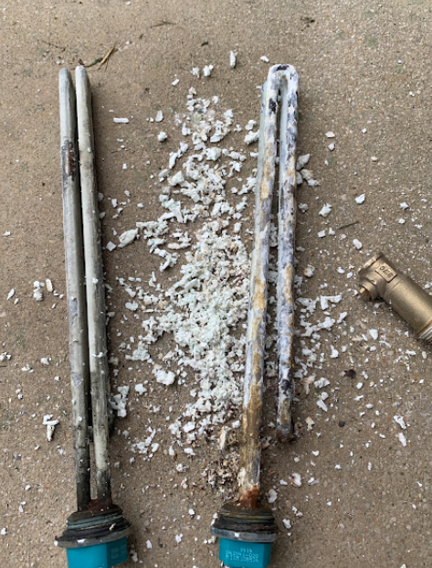 Heavily corroded water heater anode rods with mineral buildup